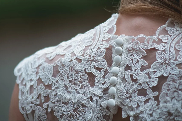 wedding gown shoulders back woman closeup